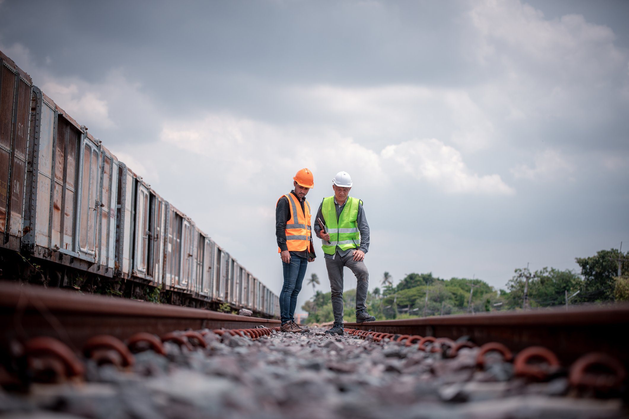 Engineer under discussion inspection and checking construction process railway switch and checking work on railroad station .Engineer wearing safety uniform and safety helmet in work. How Job Hopping Keeps You Relevant and Ready for the Future